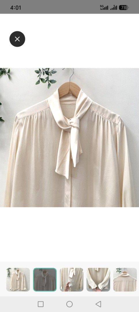 Cream Bow Neck Long Sleeve Blouse (Category: Blouses) located in Pasig City. Submitted by theatheathea (Listing ID 1460082385, Image 3). Description: - Elegant cream-colored blouse - Fits medium to large - Features a chic bow detail at the neck - Long sleeves with classic button cuffs - Easy button-down front closure - Made from a smooth, silky-feel fabric - Versatile for both casual and formal styling.