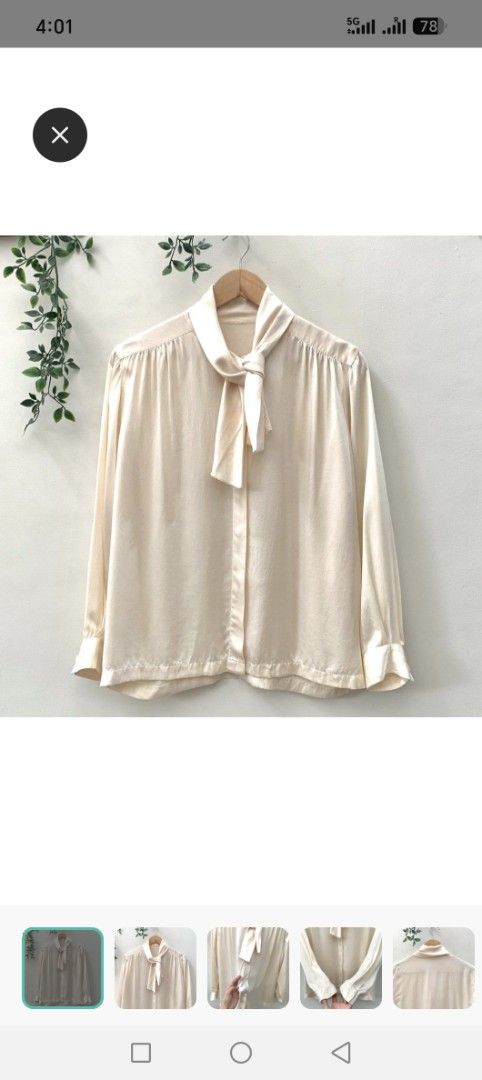 Cream Bow Neck Long Sleeve Blouse (Category: Blouses) located in Pasig City. Submitted by theatheathea (Listing ID 1460082385, Image 1). Description: - Elegant cream-colored blouse - Fits medium to large - Features a chic bow detail at the neck - Long sleeves with classic button cuffs - Easy button-down front closure - Made from a smooth, silky-feel fabric - Versatile for both casual and formal styling.