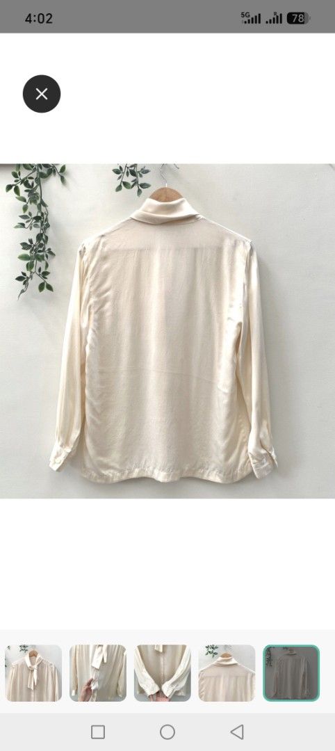 Cream Bow Neck Long Sleeve Blouse (Category: Blouses) located in Pasig City. Submitted by theatheathea (Listing ID 1460082385, Image 2). Description: - Elegant cream-colored blouse - Fits medium to large - Features a chic bow detail at the neck - Long sleeves with classic button cuffs - Easy button-down front closure - Made from a smooth, silky-feel fabric - Versatile for both casual and formal styling.