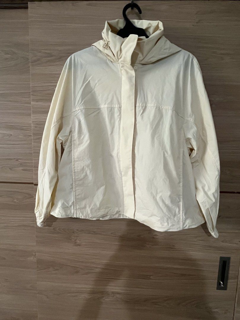 Cream Hooded Jacket with Button Front (Category: Coats, Jackets and Outerwear) located in San Juan City. Submitted by a.t_closet (Listing ID 1459919881, Image 1). Description: - Cream colored hooded jacket - Button front closure - Long sleeves with elastic cuffs - Lightweight material, ideal for layering - Back vent detail - Perfect for casual outings.