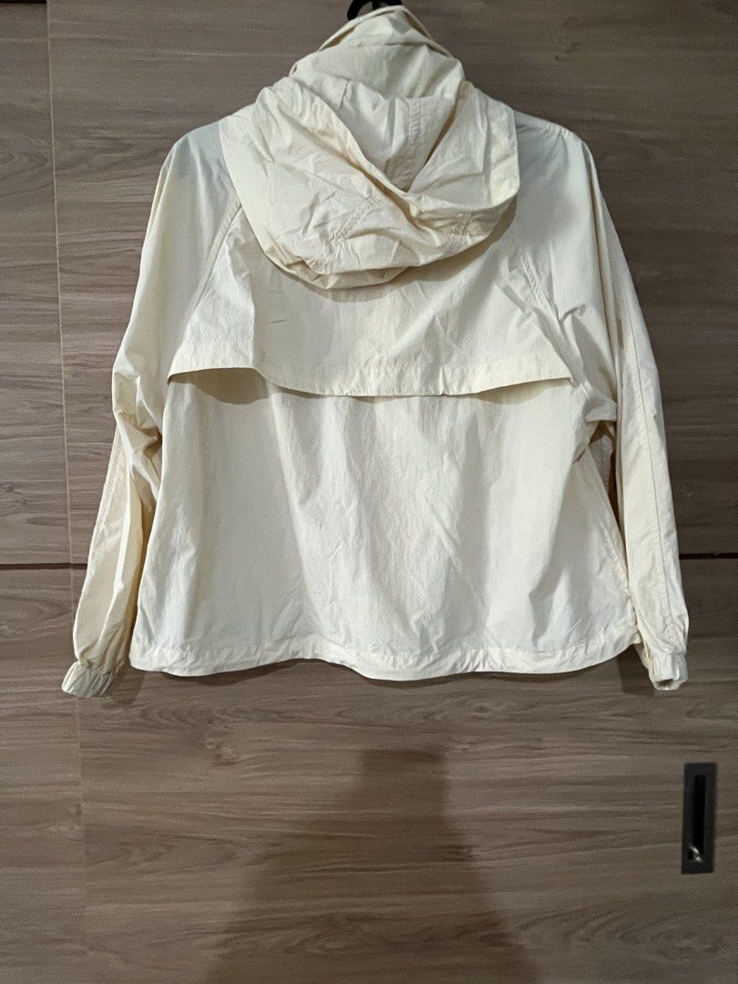 Cream Hooded Jacket with Button Front (Category: Coats, Jackets and Outerwear) located in San Juan City. Submitted by a.t_closet (Listing ID 1459919881, Image 2). Description: - Cream colored hooded jacket - Button front closure - Long sleeves with elastic cuffs - Lightweight material, ideal for layering - Back vent detail - Perfect for casual outings.