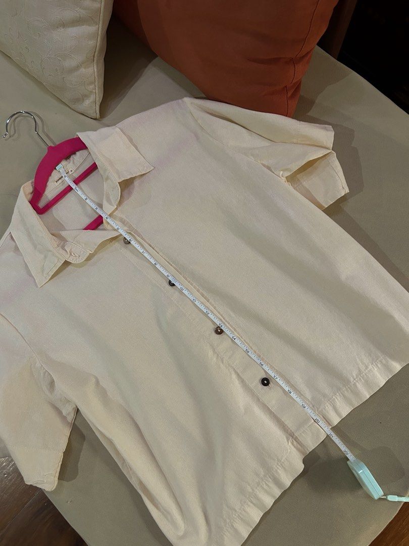Cream/oat/beige Linen Polo (Category: Shirts) located in Cainta. Submitted by unboxingstuff (Listing ID 1459965594, Image 2). Description: - Cream/oat colored short sleeve linen top - Button up front with wooden buttons - Relaxed fit for comfort - Ideal for casual outfits - Measurements available in photos.