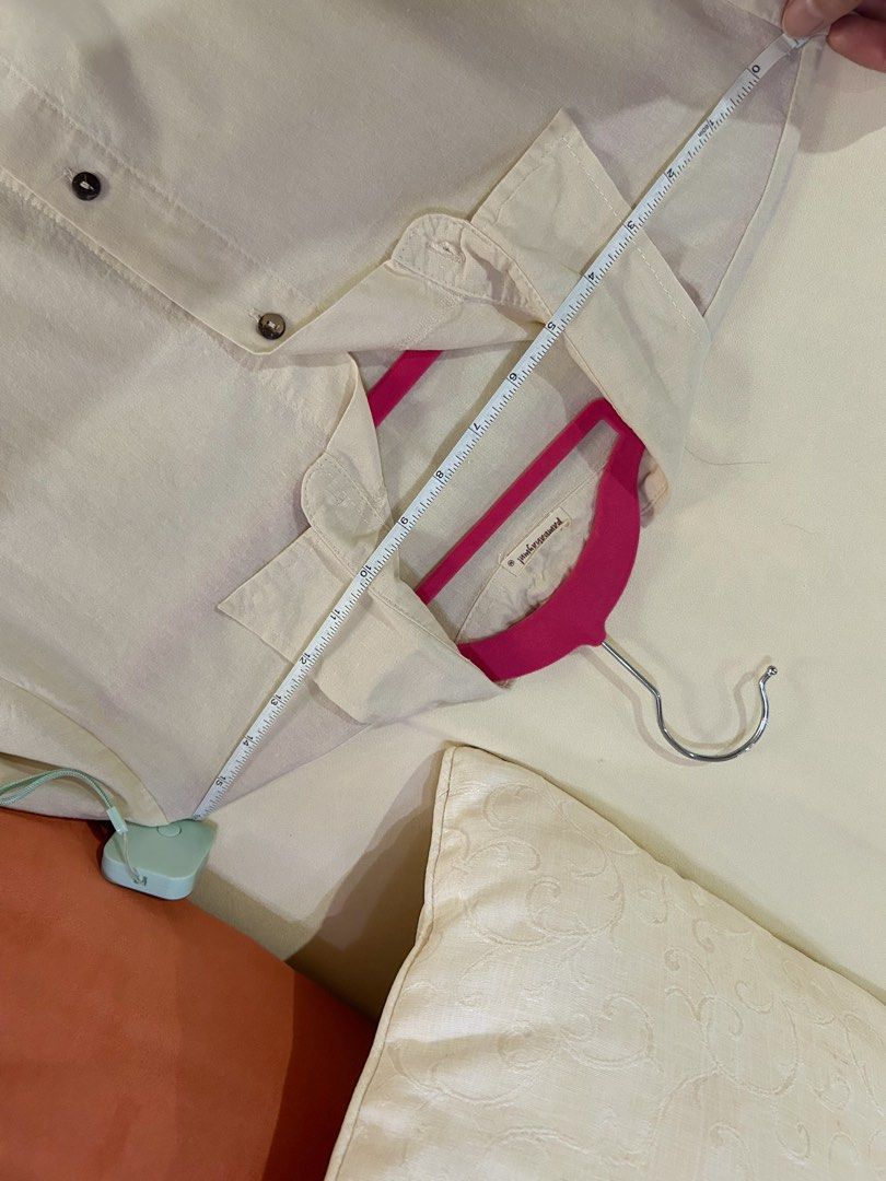 Cream/oat/beige Linen Polo (Category: Shirts) located in Cainta. Submitted by unboxingstuff (Listing ID 1459965594, Image 3). Description: - Cream/oat colored short sleeve linen top - Button up front with wooden buttons - Relaxed fit for comfort - Ideal for casual outfits - Measurements available in photos.