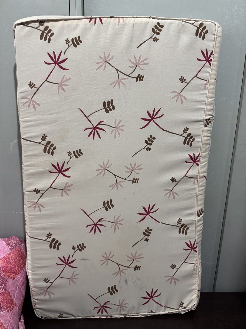 Crib foam uratex (Category: Bedding & Towels) located in Muntinlupa City. Submitted by charmycams (Listing ID 1460063075, Image 3). Description: - Cream-colored cushion with a charming floral print. - Features scattered pink and brown flowers and leaves. - Convenient zipper closure for easy cover removal. - Perfect for adding a vibrant touch to any room. - Approximate dimensions: [insert dimensions here if known]..