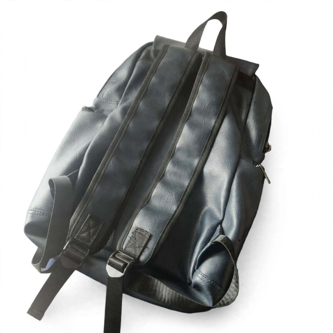 Dark Blue Faux Leather Backpack with Multiple Zippers (Category: Backpacks) located in Manila. Submitted by roseannlmn66895 (Listing ID 1459974228, Image 3). Description: *Dark Blue Faux Leather Backpack - ₱350 (negotiable)* Condition: Used - may mga tuklap pero matibay pa ✅ All zippers working ✅ Flap with magnetic button + zipper closure ✅ 2 side pockets ✅ Adjustable straps ✅ Spacious - kasya laptop / notebooks ✅ With small zip pocket inside Iss