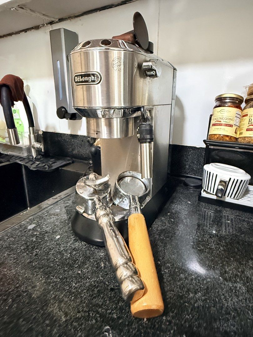 DeLonghi Espresso Machine & Coffee Grinder Bundle (Category: Coffee Machines & Makers) located in Valenzuela. Submitted by renkl1 (Listing ID 1459927729, Image 1). Description: - DeLonghi espresso machine - coffee grinder - Both in good working condition - Includes: portafilter, tamper, milk pitcher, paper filters - Perfect for home baristas - Grinder with adjustable settings for various brews - Make cafe-quality coffee at home.