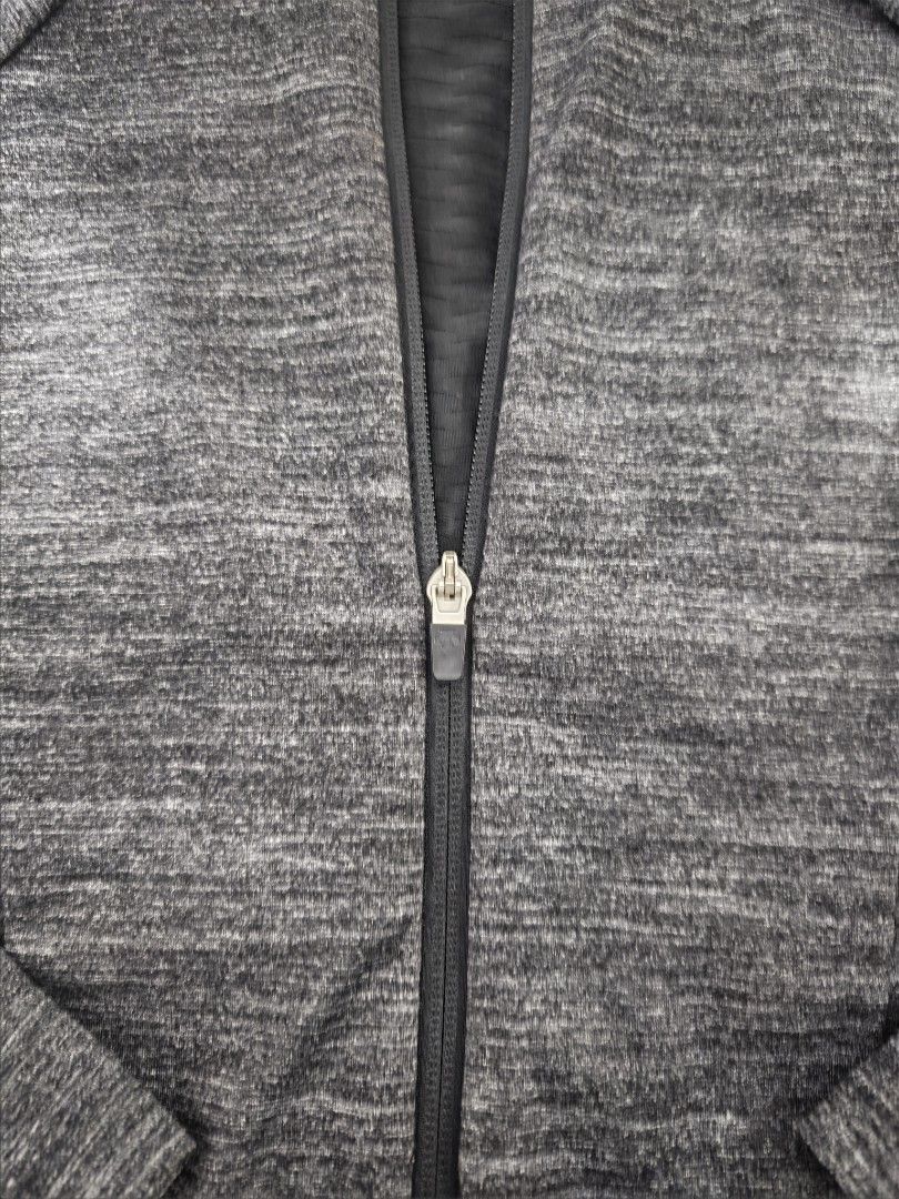 Descente Women's Grey Heathered Full Zip Jacket (Category: Coats, Jackets and Outerwear) located in Baguio. Submitted by goku_doggo (Listing ID 1460012491, Image 3). Description: - Descente Women's Jacket - Color: Grey heathered with black lower panel - Style: Full zip front with stand-up collar - Features: Two zippered side pockets - Ideal for: Workouts or casual wear - Size: S.
