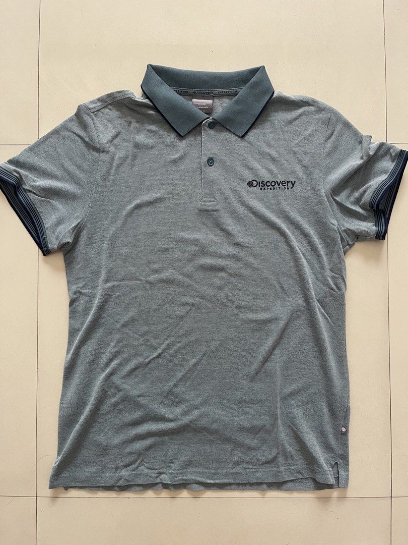 Discovery Expedition Grey Polo Shirt Size 100 (Category: Tshirts & Polo Shirts ) located in Quezon City. Submitted by kingcurator (Listing ID 1459971818, Image 1). Description: - Brand: Discovery Expedition - Color: Grey - Size: 100 - Features: Embroidered logo on chest, darker trim on collar and sleeve cuffs - Style: Comfortable and stylish polo shirt.