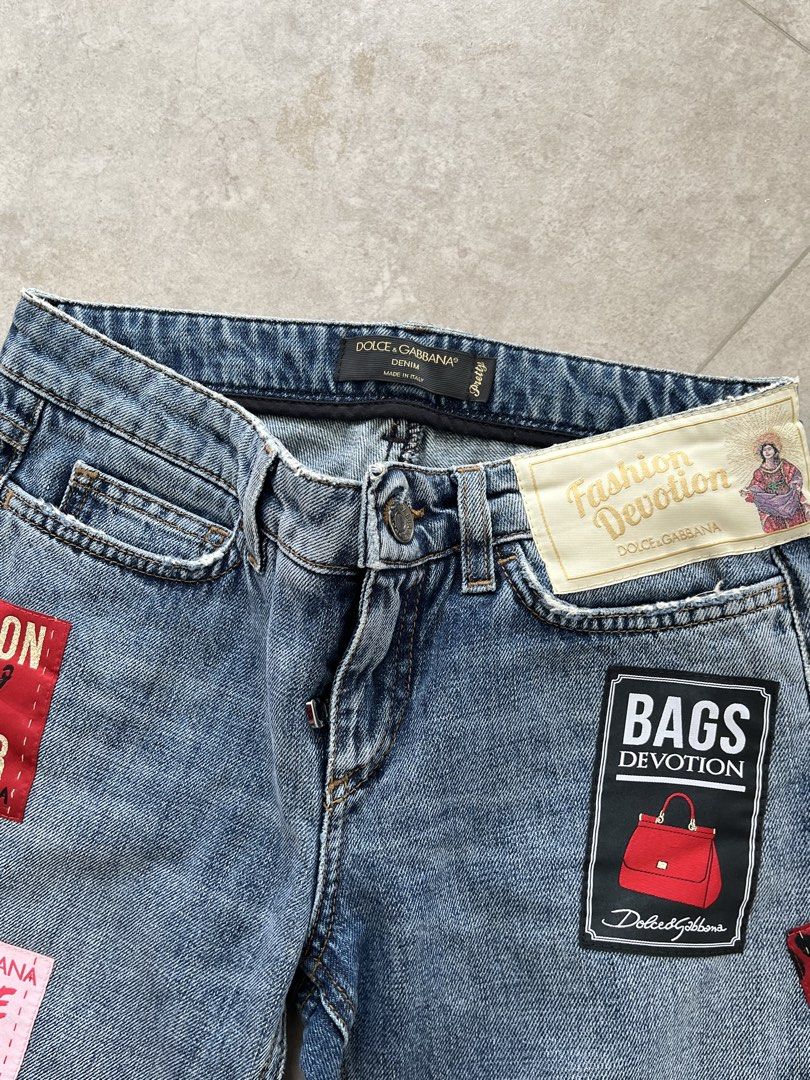Dolce & Gabbana (Category: Luxury Apparel) located in Lucena. Submitted by RAGGGGSSSS (Listing ID 1460045724, Image 2). Description: Dolce & Gabbana mid-rise blue denim jeans, assorted embroidered patches throughout. Can fit to waists 27-28 Length is 36 Thigh is 10.5 Excellent Condition Authentic No issue 1650.