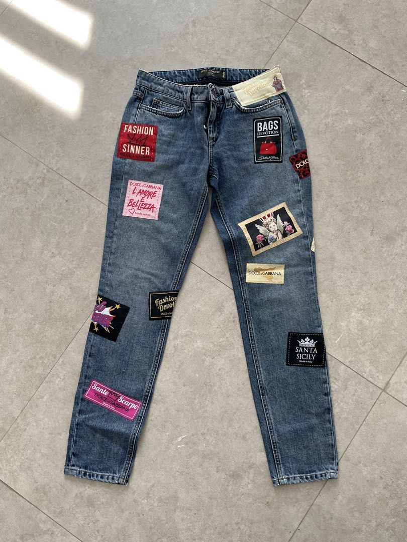 Dolce & Gabbana (Category: Luxury Apparel) located in Lucena. Submitted by RAGGGGSSSS (Listing ID 1460045724, Image 1). Description: Dolce & Gabbana mid-rise blue denim jeans, assorted embroidered patches throughout. Can fit to waists 27-28 Length is 36 Thigh is 10.5 Excellent Condition Authentic No issue 1650.