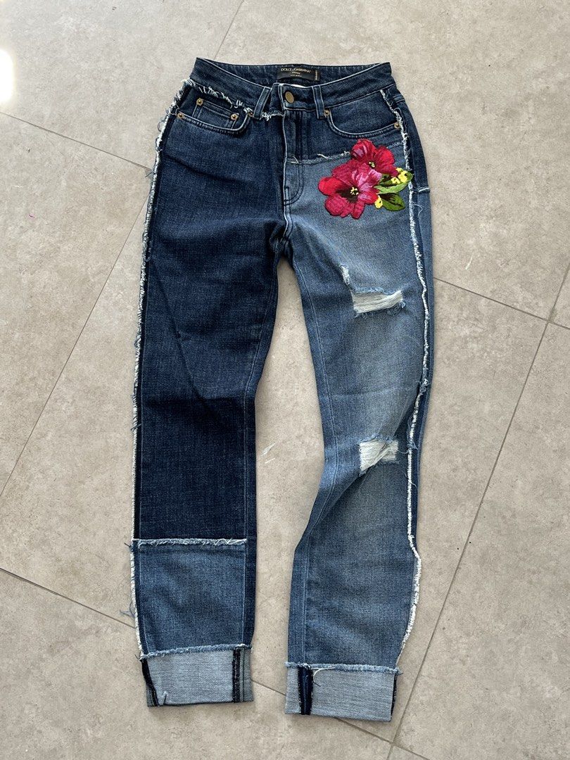 Dolce & Gabbana (Category: Luxury Apparel) located in Lucena. Submitted by RAGGGGSSSS (Listing ID 1460047872, Image 1). Description: Dolce & Gabbana two-tone patchwork denim jeans featuring distressed details and vibrant pink floral embroidery. Can fit to waists 23-24 Length is 37 Thigh is 10.5 Excellent Condition Authentic No issue 1800.