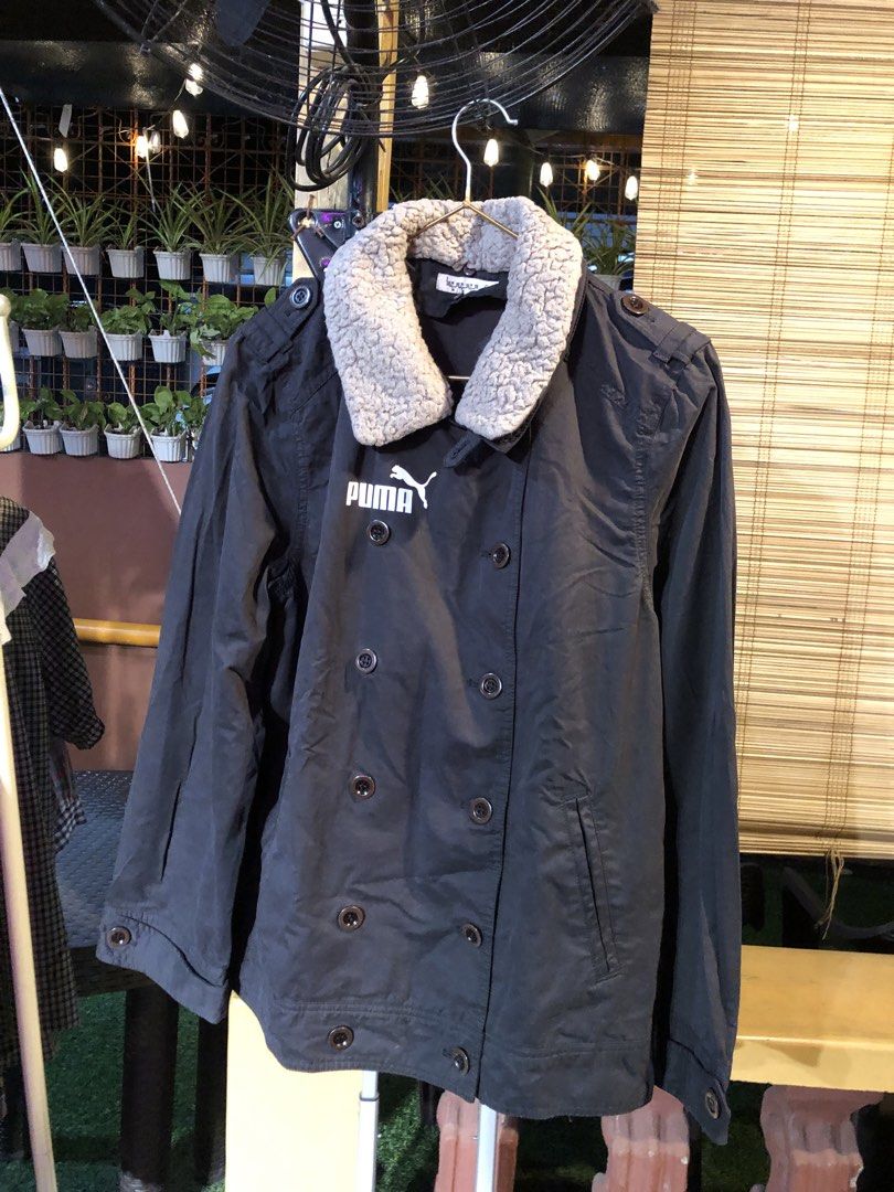 Double Breasted Jacket with Shearling Collar (Category: Coats, Jackets and Outerwear) located in Cauayan City . Submitted by wholly.craaaft (Listing ID 1460028331, Image 1). Description: - NOT Puma (just sticker) jacket in dark grey - Double-breasted button closure - Cozy shearling collar - Embroidered Puma logo on chest - Button cuffs on sleeves - Ideal for cooler weather.