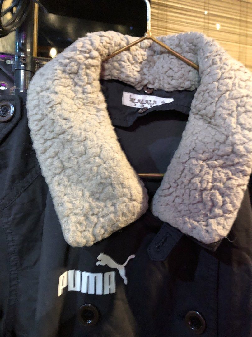Double Breasted Jacket with Shearling Collar (Category: Coats, Jackets and Outerwear) located in Cauayan City . Submitted by wholly.craaaft (Listing ID 1460028331, Image 3). Description: - NOT Puma (just sticker) jacket in dark grey - Double-breasted button closure - Cozy shearling collar - Embroidered Puma logo on chest - Button cuffs on sleeves - Ideal for cooler weather.