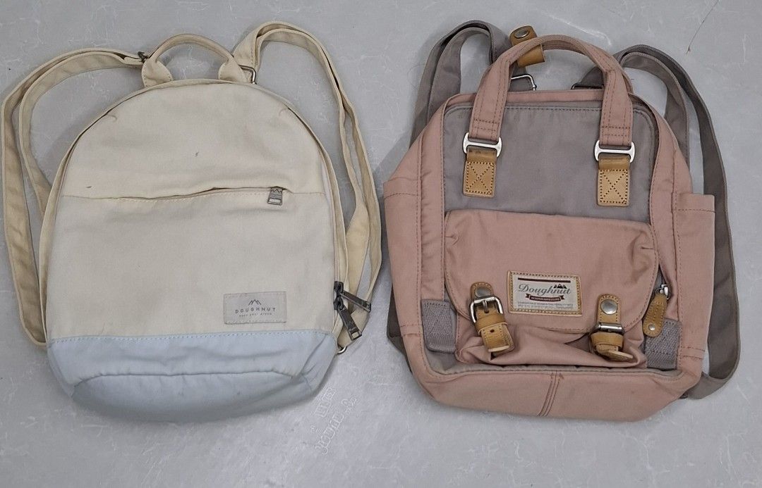 Doughnut Backpacks (2 pcs) (Category: Backpacks) located in Pasay City. Submitted by al1son18 (Listing ID 1460045867, Image 2). Description: - Two Doughnut backpacks available. - Option 1: Cream/beige with light blue base. - Option 2: Pink and grey with leather accents. - Both feature multiple compartments for organization. - Adjustable straps for comfortable carrying. - Ideal for daily commutes or travel adventures. - Please check photos for det