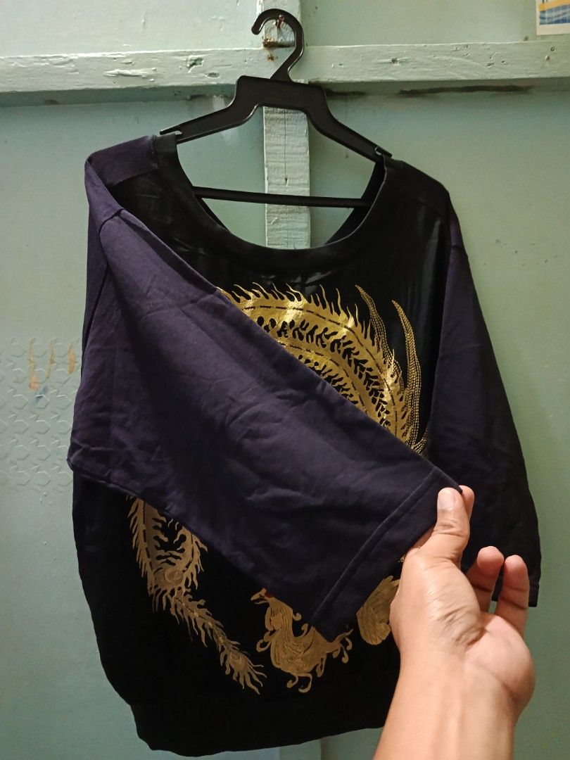 DREIS VAN NOTEN (Category: Luxury Apparel) located in Mandaluyong City. Submitted by newdepot (Listing ID 1460033583, Image 3). Description: - Dries Van Noten black 3/4 shirt - Features a gold phoenix embroidery on the back - Size: S - Dimes 21x24. shoulder 14.5 - Made in India - Material: 100% cotton.
