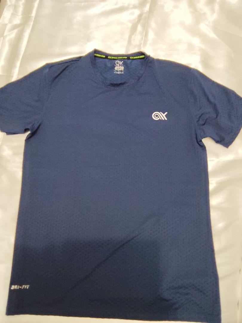 Dri-FIT Athletic T-Shirt (Category: Tshirts & Polo Shirts ) located in Quezon City. Submitted by its.leen (Listing ID 1460085456, Image 3). Description: - Available in Black and Navy Blue - Dri-FIT technology for sweat-wicking - Small logo on the chest - Reflective strip on the back for visibility - Comfortable and breathable fabric - Ideal for workouts and casual wear -200 each or 2pcs for 350.