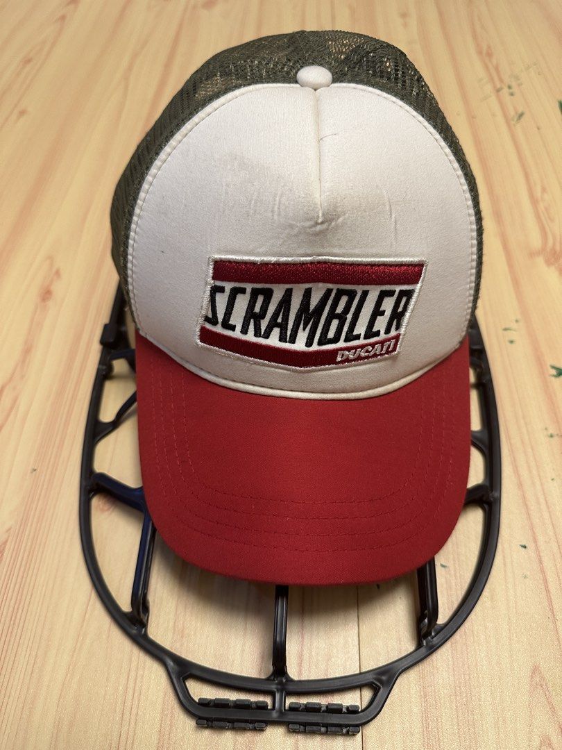 Ducati Scrambler Trucker Cap (Category: Caps & Hats) located in Quezon City. Submitted by mancave_stuff (Listing ID 1460104983, Image 1). Description: - Ducati Scrambler trucker cap - Red brim and front panel - White front panel with embroidered 'SCRAMBLER DUCATI' logo - Olive green mesh back - Adjustable snapback closure - Ideal for any Ducati enthusiast -Used once.