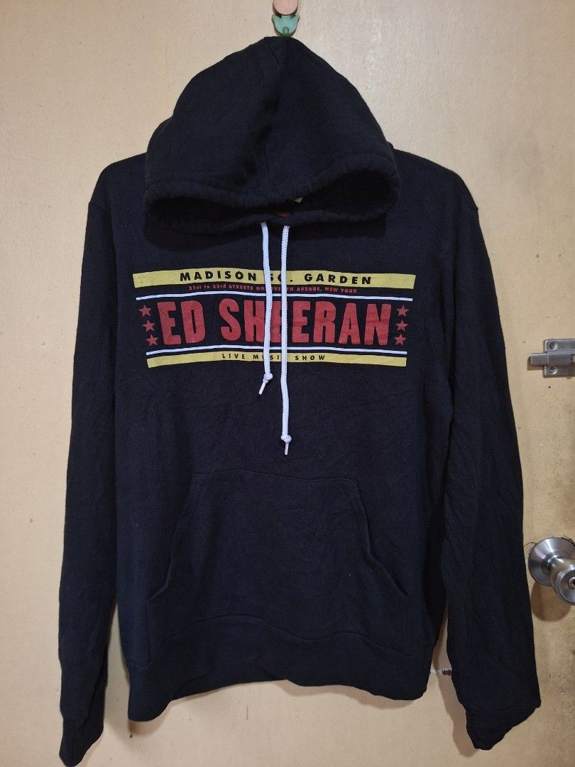 Ed Sheeran Hoodie (Category: Hoodies) located in Mabalacat. Submitted by jhaycore05 (Listing ID 1459953055, Image 1). Description: - Official Ed Sheeran Madison Square Garden concert hoodie - Features concert details prominently on the front - Made in Vietnam - Size: Medium (M) - A must-have collectible for any Ed Sheeran fan!.