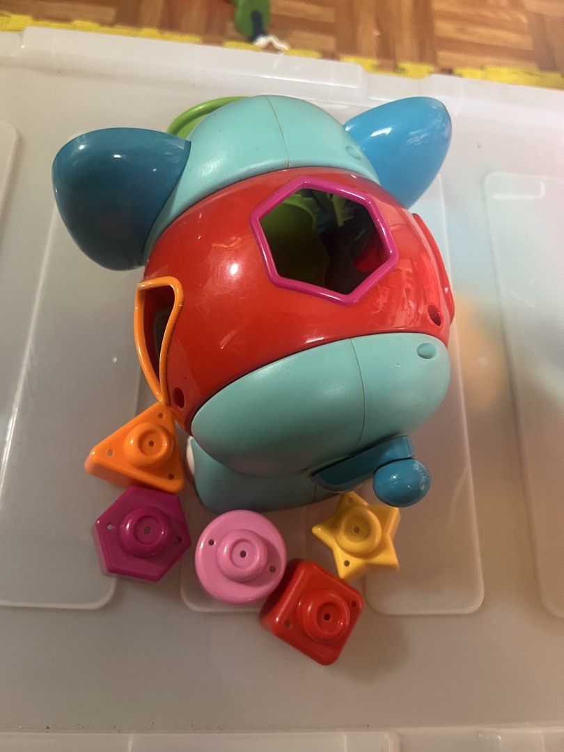 Elephant Shape Sorter Toy with Multiple Shapes (Category: Educational & Learning Toys) located in Taguig. Submitted by amorzy (Listing ID 1460025259, Image 3). Description: - Adorable elephant shape sorter toy. - Includes colorful shapes: stars, hexagons, and squares. - Features a trunk for shape sorting. - Perfect for teaching toddlers shapes and colors. - Shows minor scuffs from normal use. Location: Upper Bicutan.