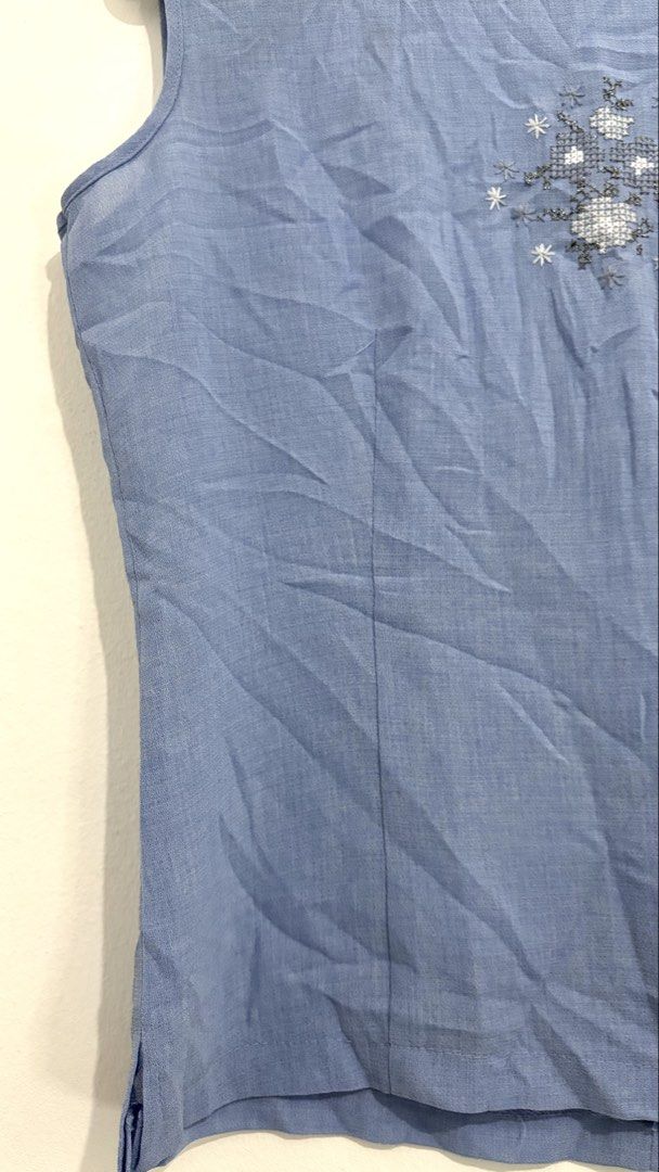 Embroidered Cross-Stitch Sleeveless Blouse (Category: Sleeveless) located in Caloocan City. Submitted by buymethisandthat (Listing ID 1460033835, Image 3). Description: ✨ Light Blue Embroidered Cross-Stitch Sleeveless Blouse - ₱99 📌 CONDITION • Condition: 8.5/10 • Flaws: Moderate creasing/wrinkling 📏 SIZE • Tag Size: No size tag • Recommended: Fits Small to Medium.