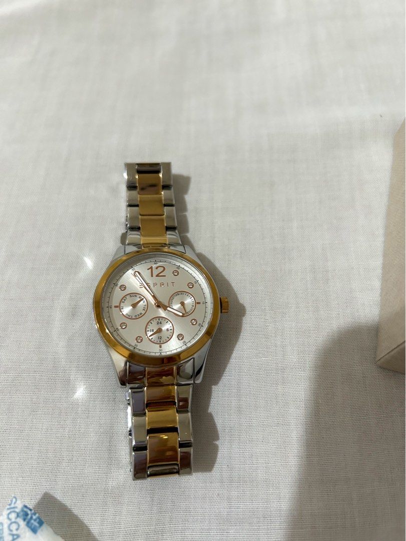 Esprit Two-Tone Stainless Steel Watch with Box (Category: Women's Watches) located in Cavite. Submitted by mommyannscloset (Listing ID 1459991205, Image 2). Description: - Esprit watch - Silver and gold tone bracelet - White dial with rose gold accents - Date and day sub-dials - Includes original box - Extra links included - Ideal for everyday wear.