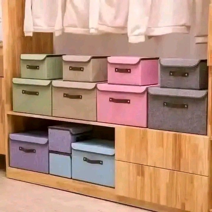 Fabric Storage Boxes with Lids and Handles (Category: Storage Boxes & Baskets) located in Bulacan. Submitted by you_finds (Listing ID 1459916349, Image 1). Description: - Set of fabric storage boxes - Available colors: green, beige, pink, grey, purple, light blue - Features lids and handles for easy carrying - Ideal for organizing clothes, toys, and household items - Stackable design for efficient space-saving - Perfect for decluttering closets a