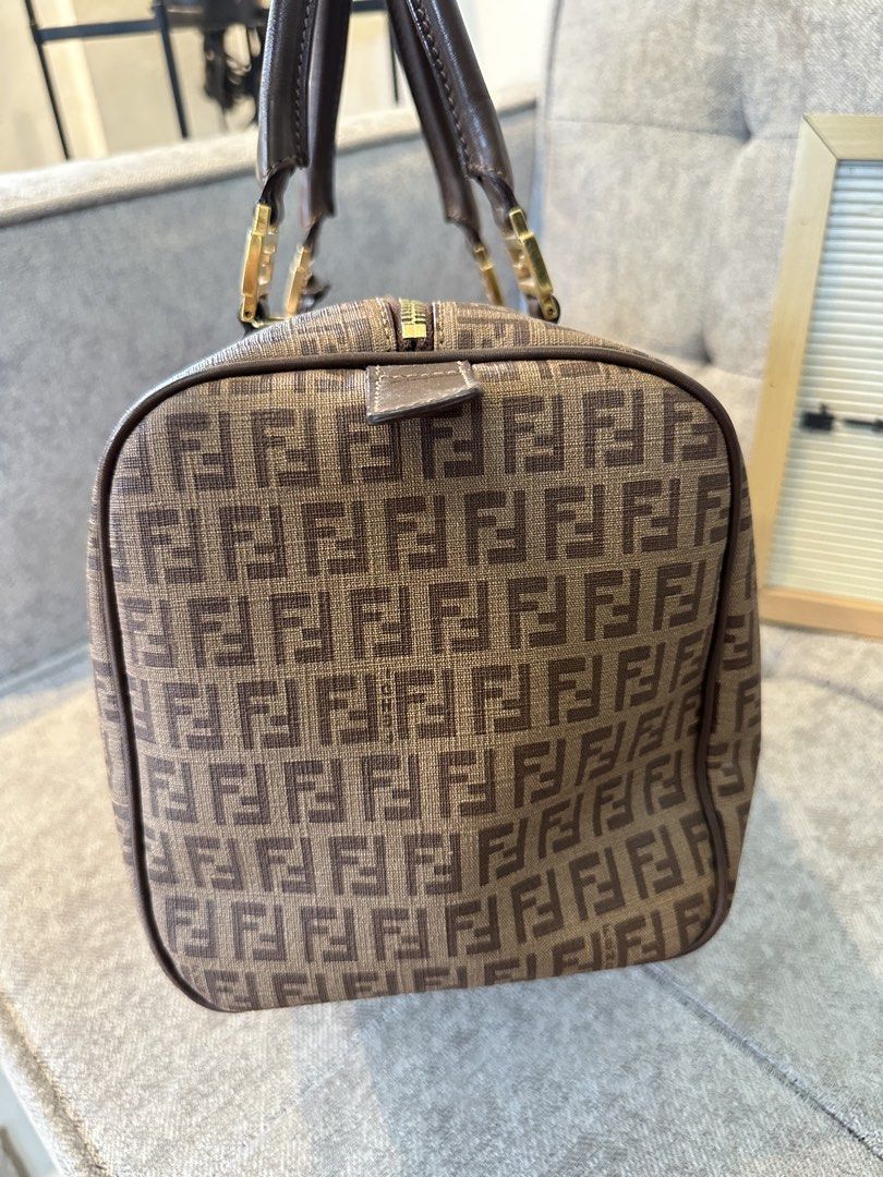 Fendi Zucca Boston Bag (Category: Luxury Bags & Wallets) located in Los Banos. Submitted by joshua_morales (Listing ID 1460075727, Image 3). Description: - Classic Fendi Boston bag - Iconic Zucca print in brown and tan canvas - Genuine leather trim - Gold hardware details - Comes with original lock and key - Ideal size for daily essentials - A timeless and stylish accessory.