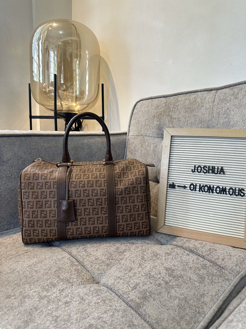 Fendi Zucca Boston Bag (Category: Luxury Bags & Wallets) located in Los Banos. Submitted by joshua_morales (Listing ID 1460075727, Image 1). Description: - Classic Fendi Boston bag - Iconic Zucca print in brown and tan canvas - Genuine leather trim - Gold hardware details - Comes with original lock and key - Ideal size for daily essentials - A timeless and stylish accessory.