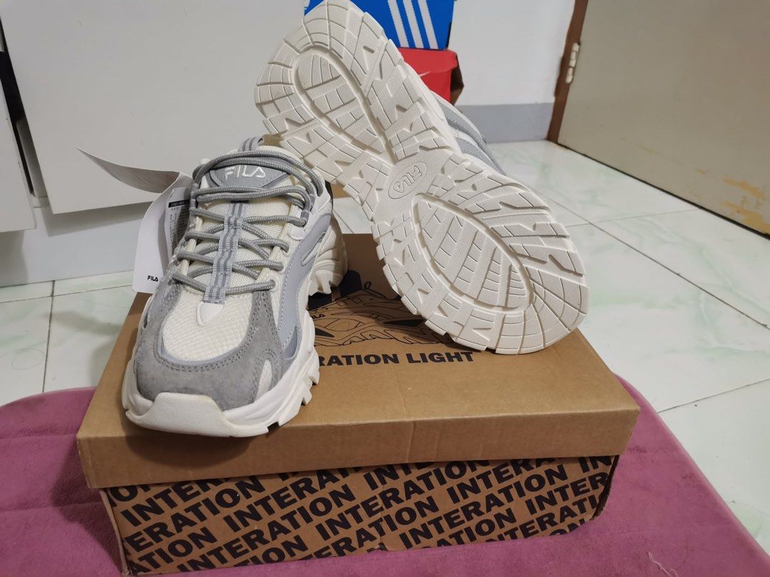 Fila Ray Tracer 2 Sneakers White Grey (Category: Sneakers) located in Taguig. Submitted by oceanwaves21 (Listing ID 1459932573, Image 1). Description: Never been used. Rfs. Decluttering - Fila Ray Tracer 2 sneakers - Color: White and Grey - Features a trendy chunky sole design - Includes extra laces in a separate bag - Original Fila box provided - Ideal for everyday casual wear.