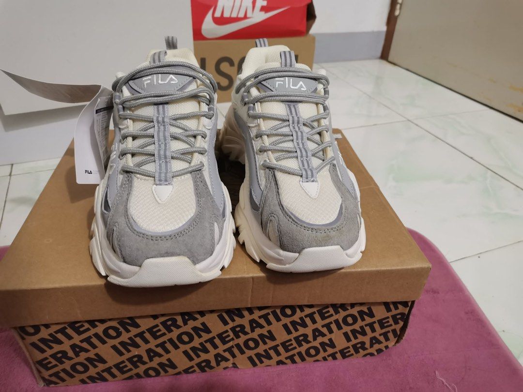 Fila Ray Tracer 2 Sneakers White Grey (Category: Sneakers) located in Taguig. Submitted by oceanwaves21 (Listing ID 1459932573, Image 3). Description: Never been used. Rfs. Decluttering - Fila Ray Tracer 2 sneakers - Color: White and Grey - Features a trendy chunky sole design - Includes extra laces in a separate bag - Original Fila box provided - Ideal for everyday casual wear.