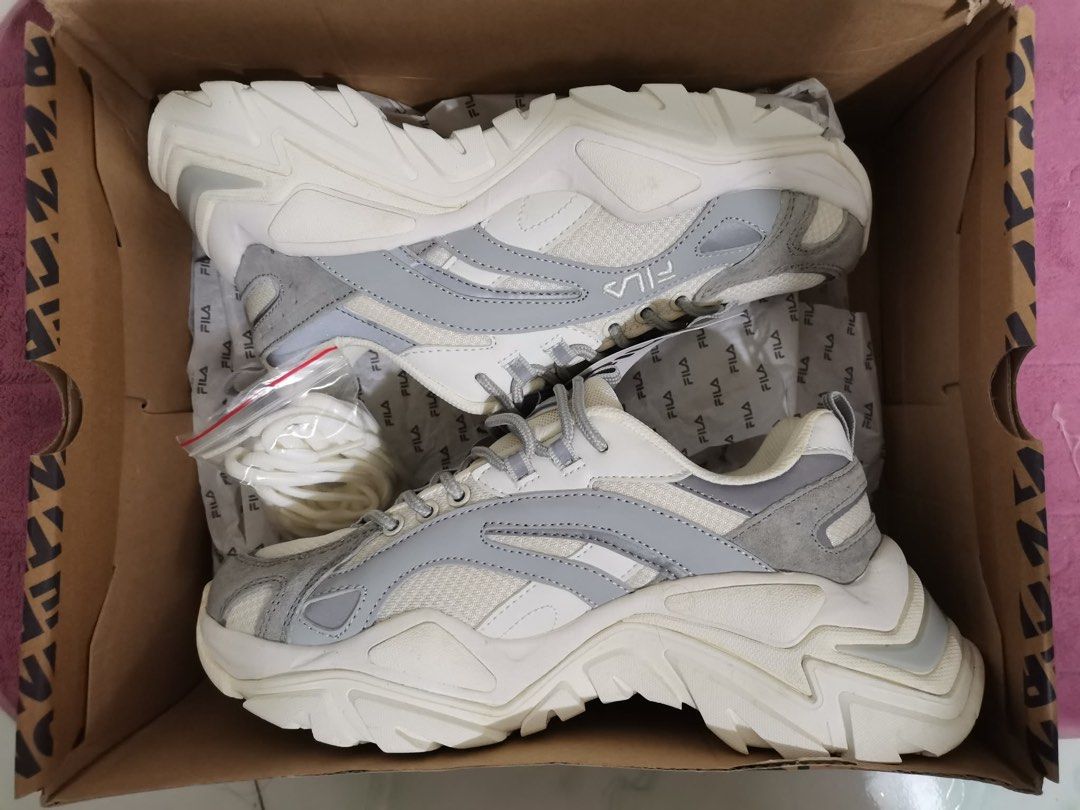 Fila Ray Tracer 2 Sneakers White Grey (Category: Sneakers) located in Taguig. Submitted by oceanwaves21 (Listing ID 1459932573, Image 2). Description: Never been used. Rfs. Decluttering - Fila Ray Tracer 2 sneakers - Color: White and Grey - Features a trendy chunky sole design - Includes extra laces in a separate bag - Original Fila box provided - Ideal for everyday casual wear.