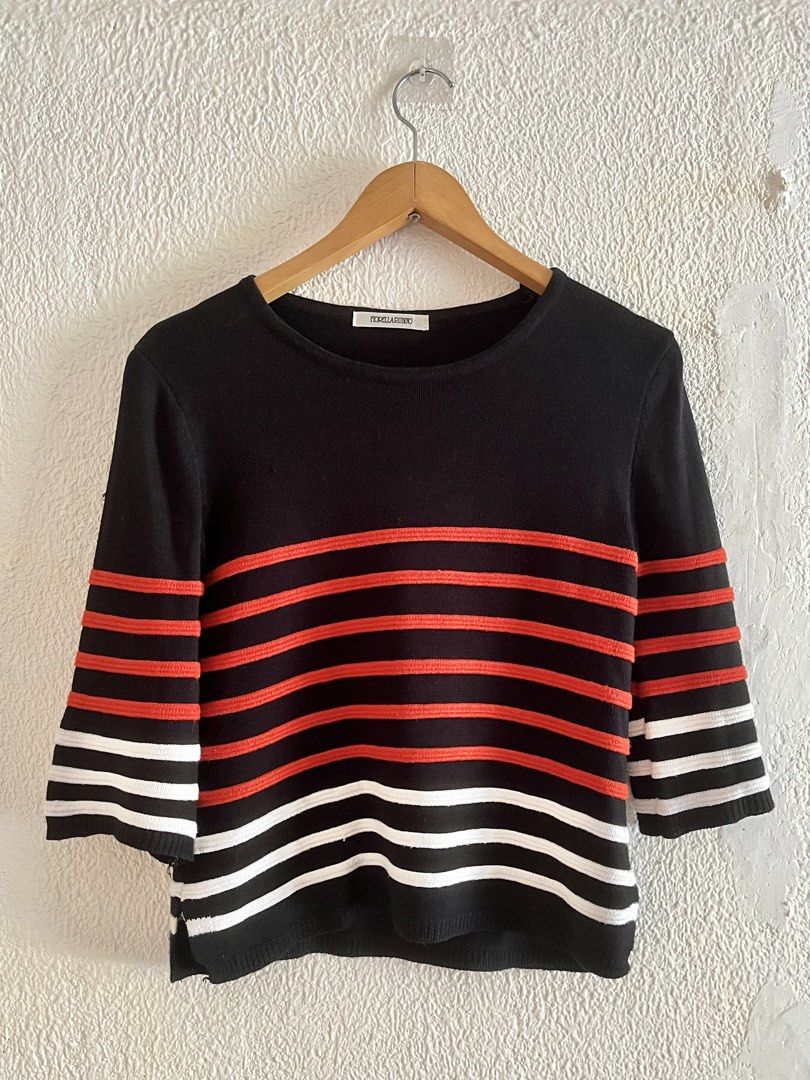 Fiorella Rubino 3/4 Sleeve Top (Category: Blouses) located in Cebu City. Submitted by danabelleza (Listing ID 1459976149, Image 1). Description: - Stylish black top with eye-catching orange and white stripes. - Comfortable three-quarter sleeves with a chic flared cuff. - Classic round neckline. - Made from a soft, knit-like material. - Ideal for everyday casual wear..