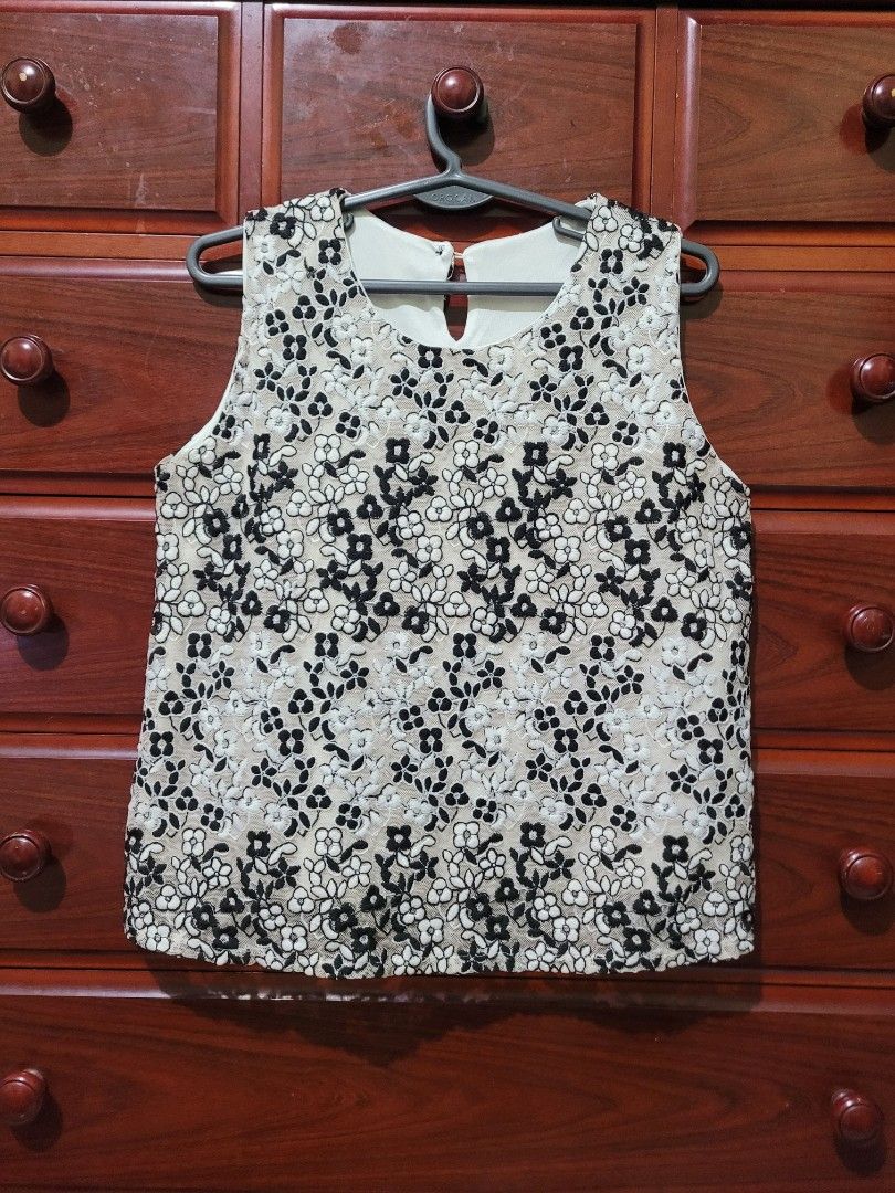 Floral Lace Sleeveless Top (Category: Sleeveless) located in Mangaldan. Submitted by cha_reyna (Listing ID 1459998166, Image 1). Description: - Sleeveless design - Delicate floral lace overlay - Light beige base color - Black and white floral patterns - Round neckline - Keyhole detail at the back - Versatile for dressing up or down.