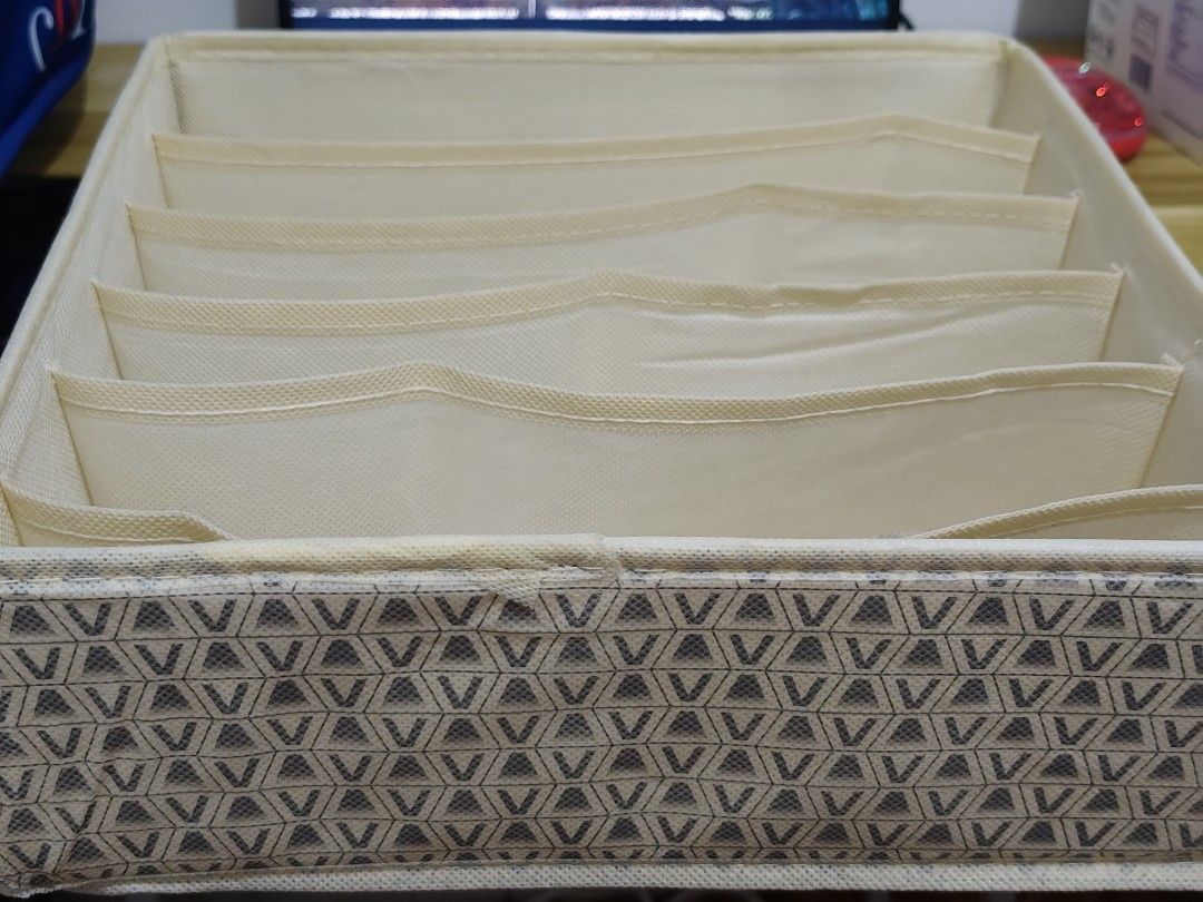 Foldable Fabric Storage Organizer with Compartments (Category: Storage Boxes & Baskets) located in Taytay. Submitted by goldentree-b9df (Listing ID 1460040711, Image 2). Description: - Multi-compartment fabric storage organizer - Stylish geometric exterior pattern - Folds flat for easy storage when not in use - Perfect for organizing drawers and shelves - Keeps your belongings neat and tidy.