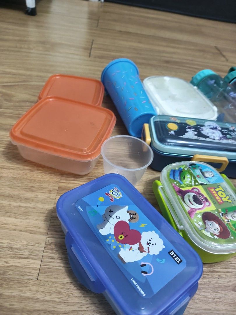 for sale Assorted Lunch Boxes, Bottles, and Containers (Category: Food Organization & Storage) located in Mandaluyong City. Submitted by derekalava (Listing ID 1460090272, Image 2). Description: for sale Assorted Lunch Boxes, Bottles, and Containers Bundle includes various food containers and water bottles. - Features two orange square containers. - Includes a blue BT21 lunch box. - Includes a Toy Story lunch box. - Also includes a 'Dream Space' 