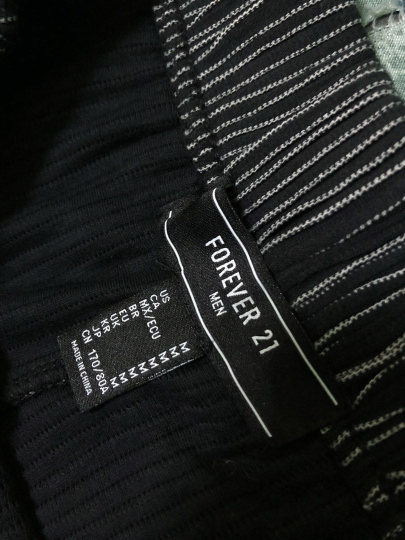 Forever 21 Men's Striped Shorts Size M (Category: Shorts) located in Manila. Submitted by da_vincr (Listing ID 1459985574, Image 2). Description: - Brand: Forever 21 Men's - Color: Black with thin white stripes - Size: Medium - Features: Elastic waistband with drawstring - Style: Casual, Loungewear - Condition: Comfortable fit - Never been used .