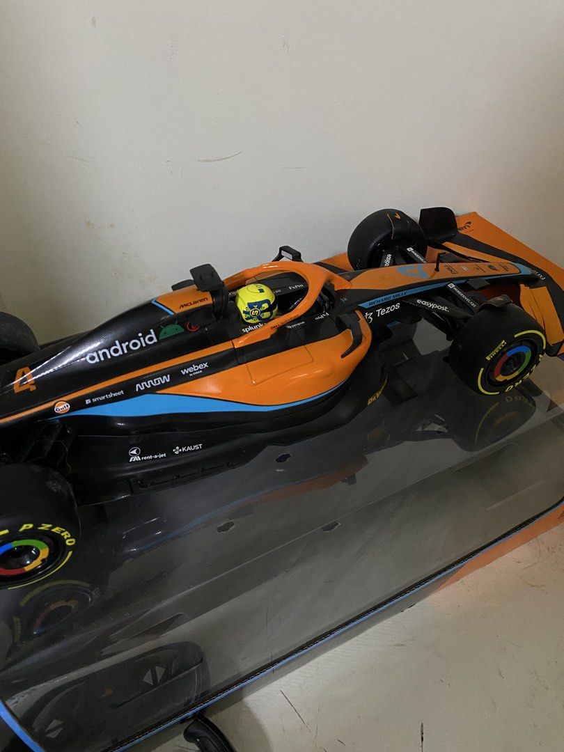 Formula 1 Mclaren - Lando Norris with Controller (Category: Remote Control Toys) located in Taguig. Submitted by sharpcautions (Listing ID 1460047669, Image 2). Description: - This is only for furniture or design at home since the supposed battery outlet is broken but if yall find a way to fix it, the controller is still working just fine.