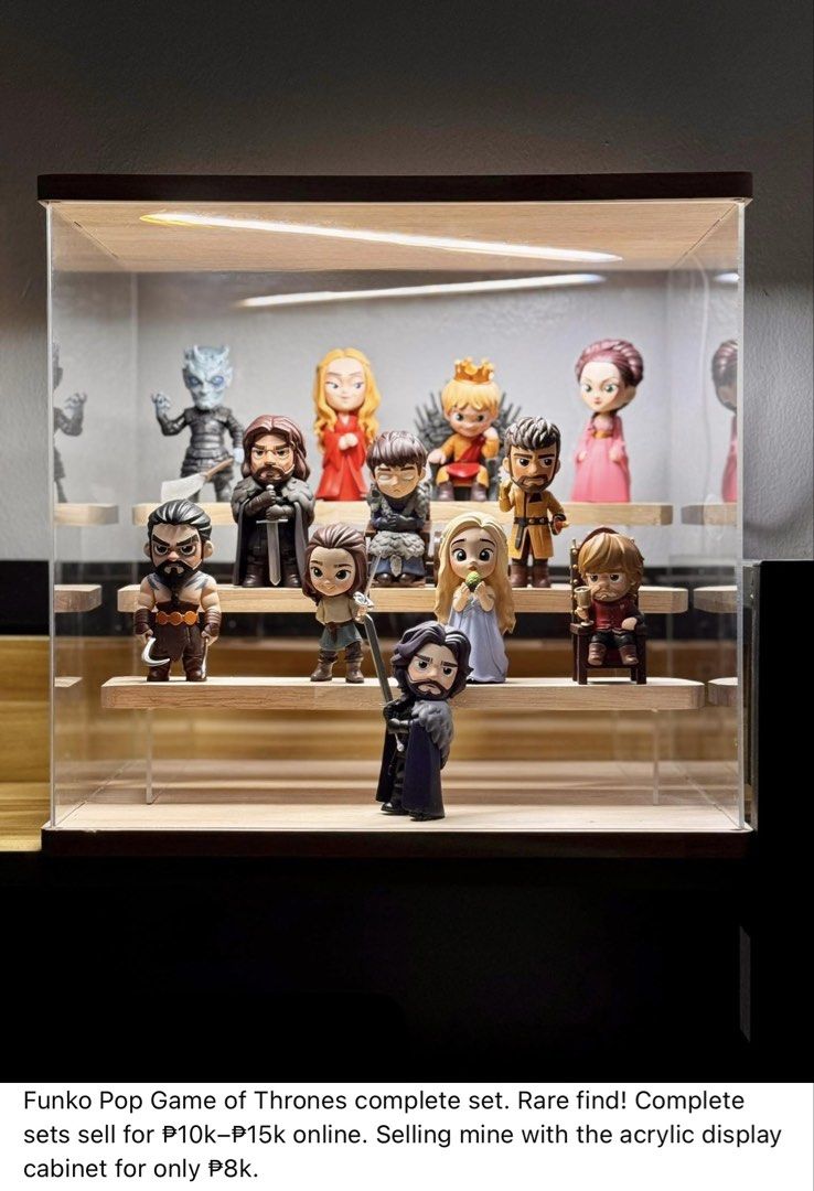 Funko Pop Game of Thrones Complete Set with Display Cabinet (Category: Designer & Blind Box Toys) located in Imus. Submitted by keptarchive (Listing ID 1459999694, Image 1). Description: - Complete Funko Pop Game of Thrones set - Includes acrylic display cabinet - Rare and highly sought-after collection - Priced at P8,000 (significantly lower than market value of P10k-P15k) - Ideal for any Game of Thrones enthusiast.