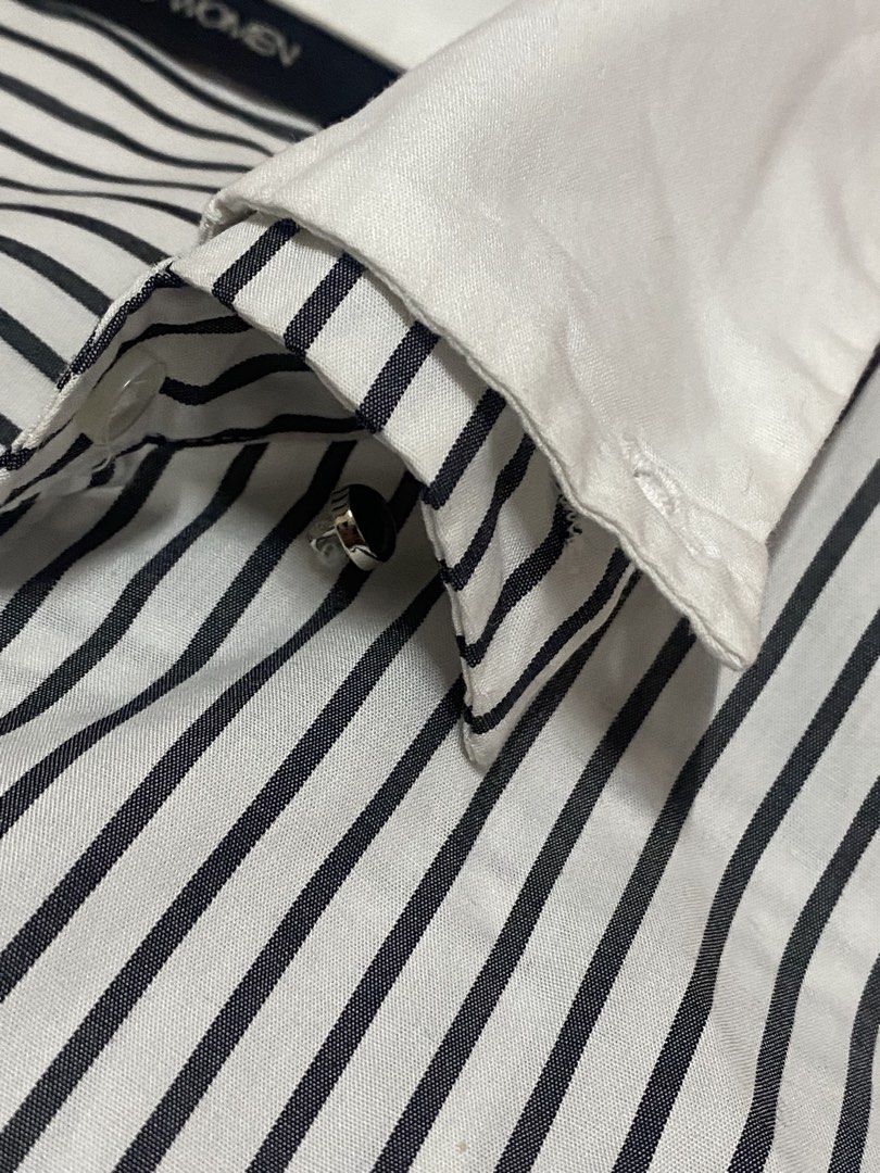 Striped Button-Up Fitted White Collar (Category: Shirts) located in Quezon City. Submitted by kkathfrancsco (Listing ID 1460032538, Image 3). Description: - Classic black and white striped pattern - Crisp white collar - Short sleeves with white cuffs - Flattering fit - Button closure down the front - Versatile for work or casual wear Fit from Semi-medium to Large.