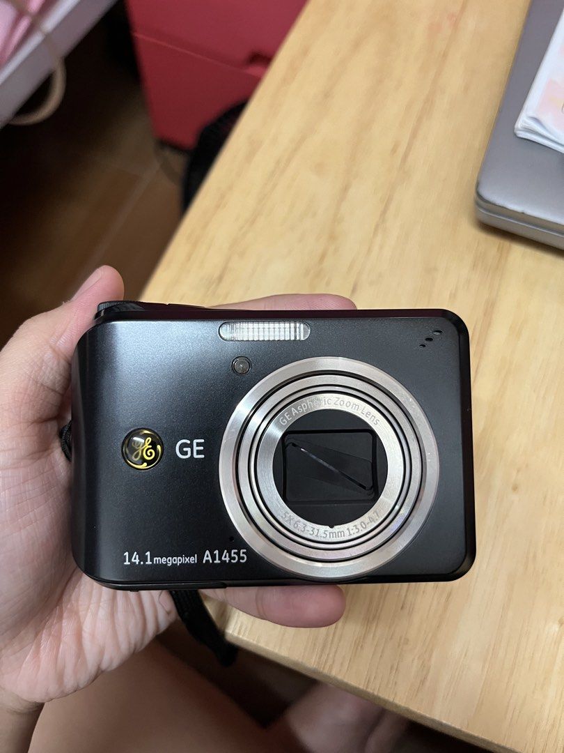 GE A1455 14.1MP Digital Camera 5x Optical Zoom (Category: Cameras) located in Manila. Submitted by prelovedbycari (Listing ID 1459931808, Image 1). Description: - GE A1455 Digital Camera - 14.1 Megapixel Resolution - 5x Optical Zoom Lens - Compact and User-Friendly Design - Perfect for Everyday Photography - Includes Wrist Strap - USB Charging - SD/SDHC Card Slot.