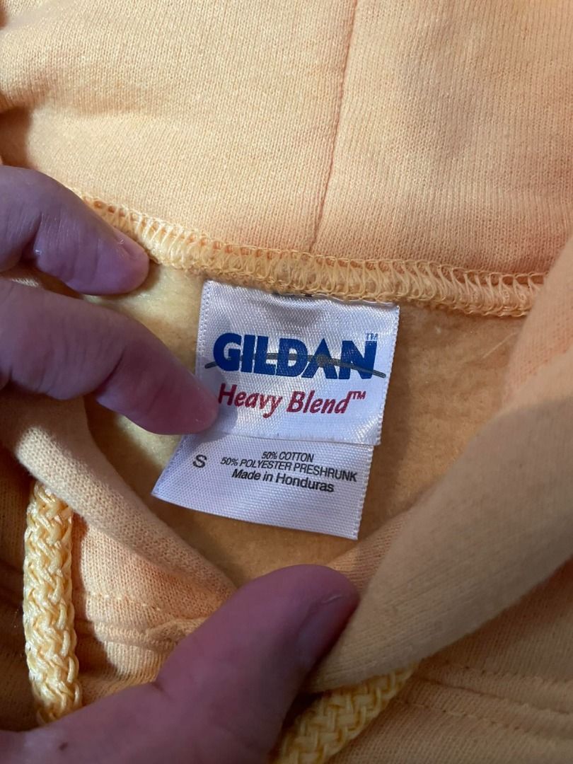 Gildan Heavy Blend Hoodie (Yellow) (Category: Hoodies) located in Antipolo. Submitted by Benjgeronimo (Listing ID 1460053826, Image 2). Description: Gildan Heavy Blend Hoodie (Yellow) Price: ₱300 Item is from US, not thrifted. Details: - Gildan Heavy Blend - Color: Yellow - Fleece lining inside - Hood with drawcord - Front kangaroo pocket - Ribbed cuffs and hem Color rate: 10/10 Dimensions: 25x19.5 in Condition: - Needs wash - Color may look slig