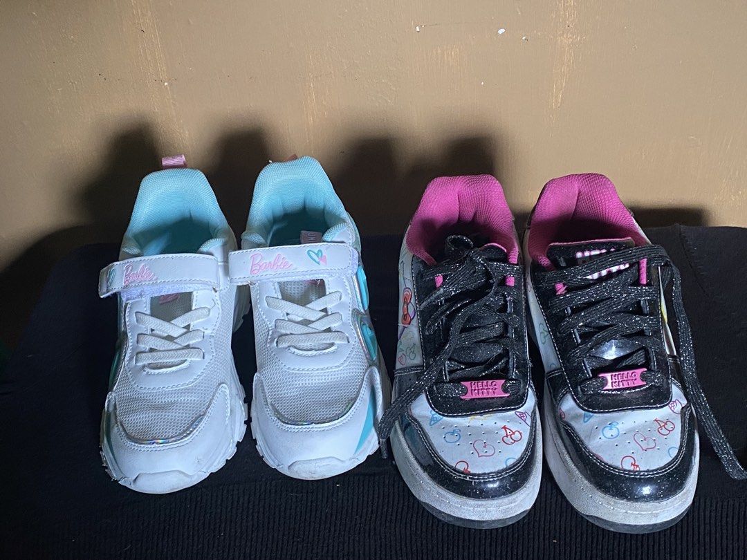 Girls' Barbie & Hello Kitty Sneakers Bundle (Category: Babies & Kids Fashion) located in Las Pinas. Submitted by myretail4sale (Listing ID 1460104292, Image 1). Description: - Bundle of 2 girls' sneakers - Pair 1: Barbie branded, white and light blue - Pair 2: Kitty design, black, white, and pink - Both are cute and ready for playtime barbie is 10 inches hello kitty is 9 inches .