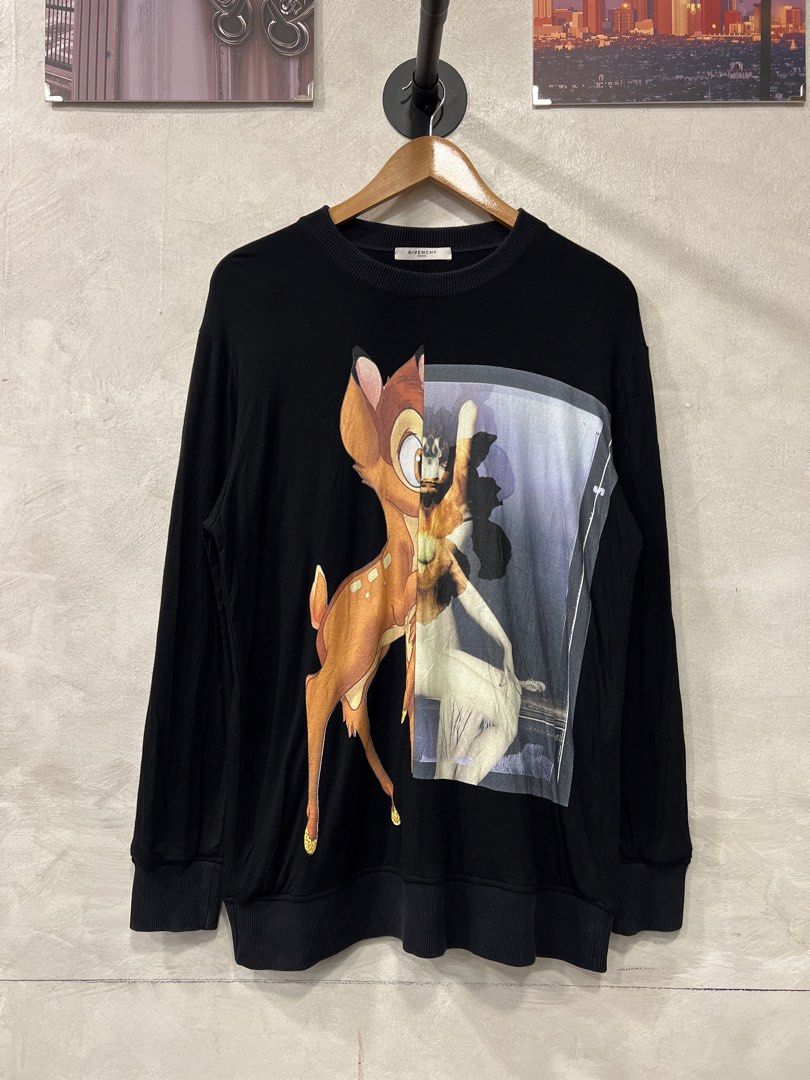 Givenchy Bambi Graphic Print Crewneck (Category: Longsleeves) located in Manila. Submitted by -handpick- (Listing ID 1459951640, Image 1). Description: This is a black Givenchy crewneck sweatshirt featuring an iconic split graphic of Bambi alongside a vintage portrait collage. Size : Small Dimensions : Length: 29 inches Width: 21 inches Shoulder : 19 inches Sleeve :23 inches Sign of wear in good condition .