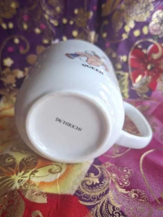 Glinda the Good Witch Mug (Category: Coffee & Tea Tableware) located in Consolacion. Submitted by luxekerei (Listing ID 1457263766, Image 2). Description: - white ceramic mug features a whimsical illustration of Glinda the Good Witch from The Wizard of Oz with the word "QUEEN" printed below.