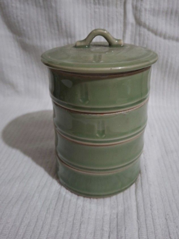 Green Ceramic Multi tiered container (Category: Storage Boxes & Baskets) located in Consolacion. Submitted by luxekerei (Listing ID 1458938157, Image 1). Description: - green glazed ceramic lidded stacking jar or multi-tiered container with horizontal ridging details..