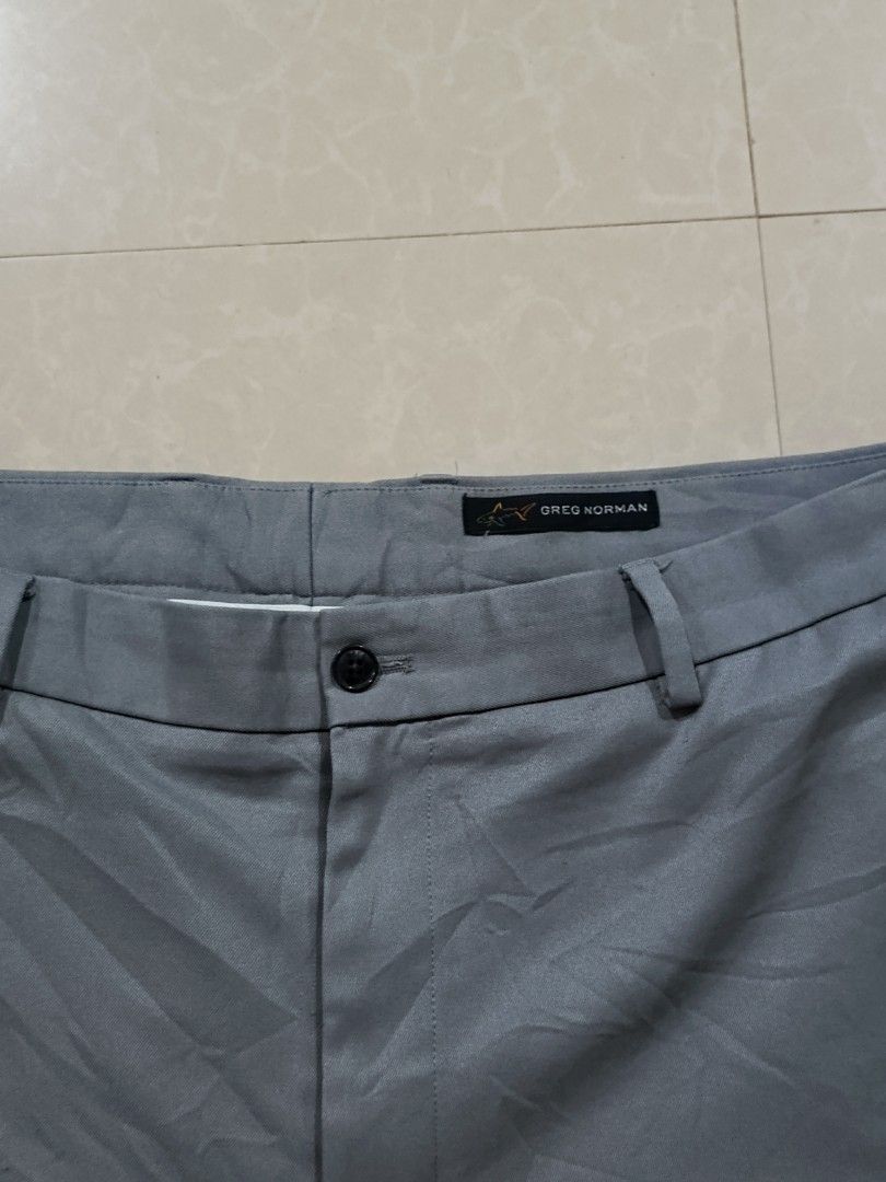 Greg Norman Grey Polyester Shorts Size 36 (Category: Shorts) located in Cabatuan. Submitted by penthegreat (Listing ID 1460060554, Image 2). Description: AUTHENTIC 🔥🔥🔥 9/10 condition - Brand: Greg Norman - Color: Grey - Material: 100% Polyester - Features: Zip pocket on left thigh, two back pockets with button closures - Closure: Button and zip fly - Ideal for: Casual wear or golf.