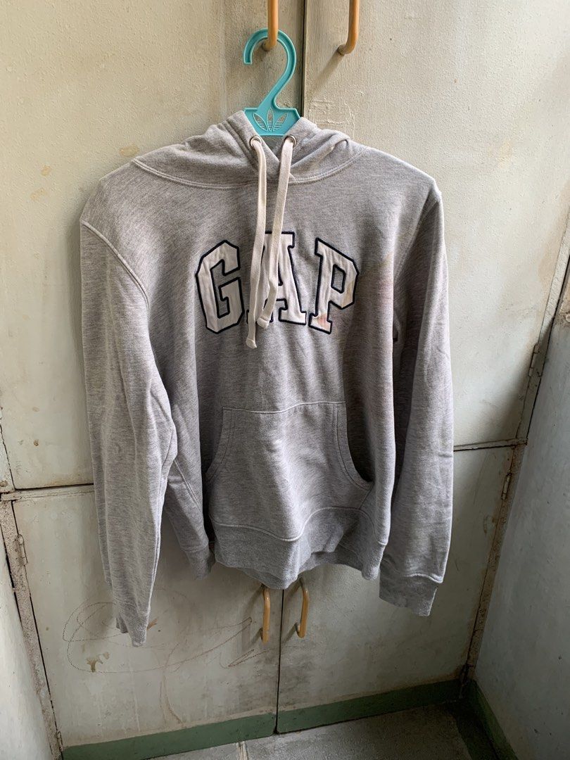 Grey GAP Hoodie (Category: Coats, Jackets and Outerwear) located in Manila. Submitted by usagichan_rabbit (Listing ID 1459944601, Image 1). Description: - Grey GAP hoodie - Minor stains on front and sleeve (please check photos) - Still comfortable for casual wear Xs size.