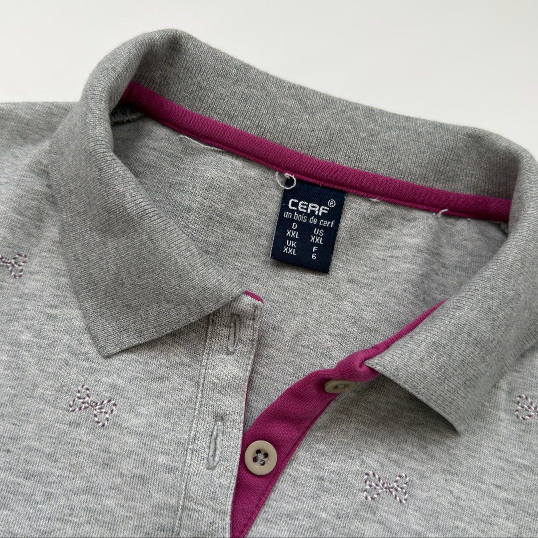Grey Quarter Button Longsleeve Shirt (Category: Longsleeves) located in Kawit. Submitted by grazielaa (Listing ID 1460026070, Image 3). Description: - Grey sweater with collar - Small pink and white stripe bows across the chest .