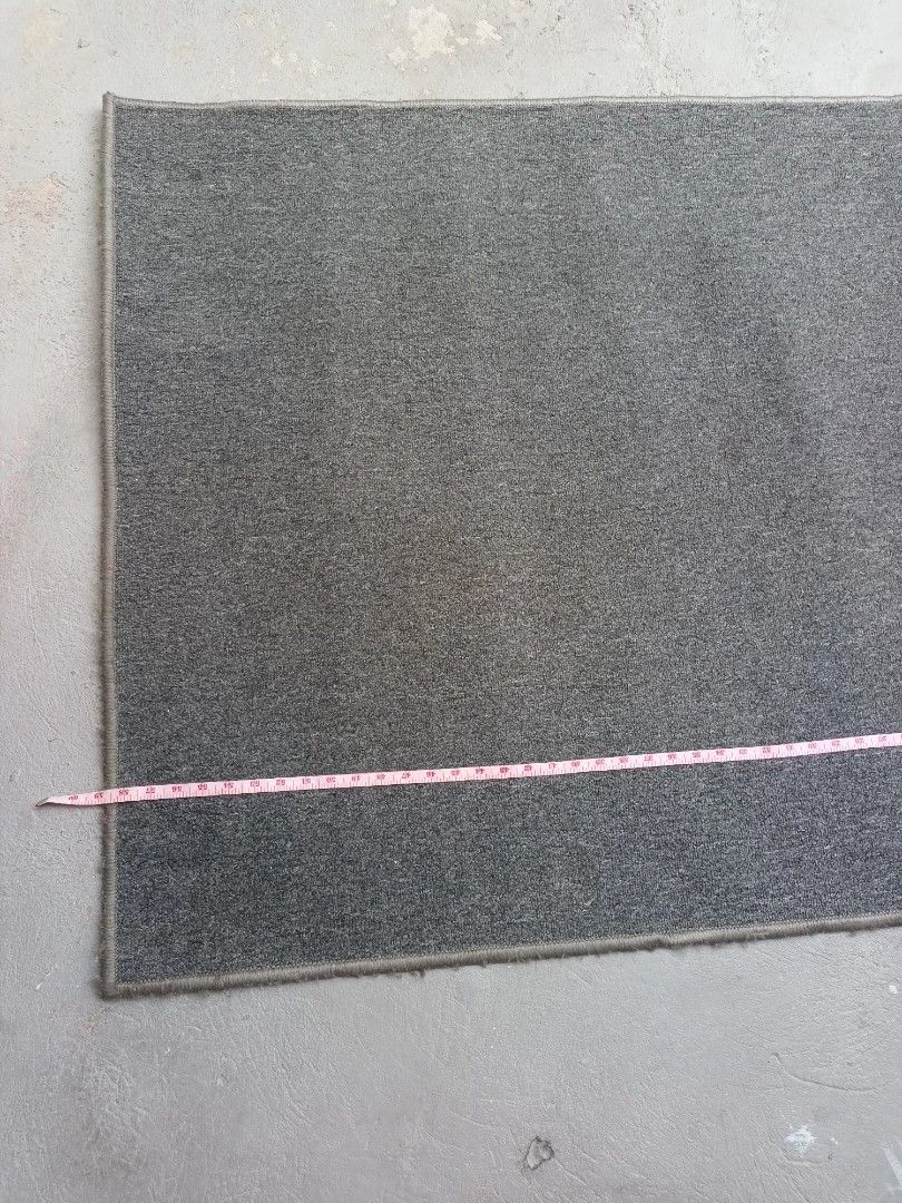 Grey Rectangular Carpet (Category: Carpets, Mats & Flooring) located in Paranaque City. Submitted by rizatamayo (Listing ID 1459995257, Image 2). Description: - Grey rectangular rug - Approximate dimensions: 60 inches x 30 inches - Ideal for entryways or hallways - Simple and functional design - Versatile fit for most spaces.