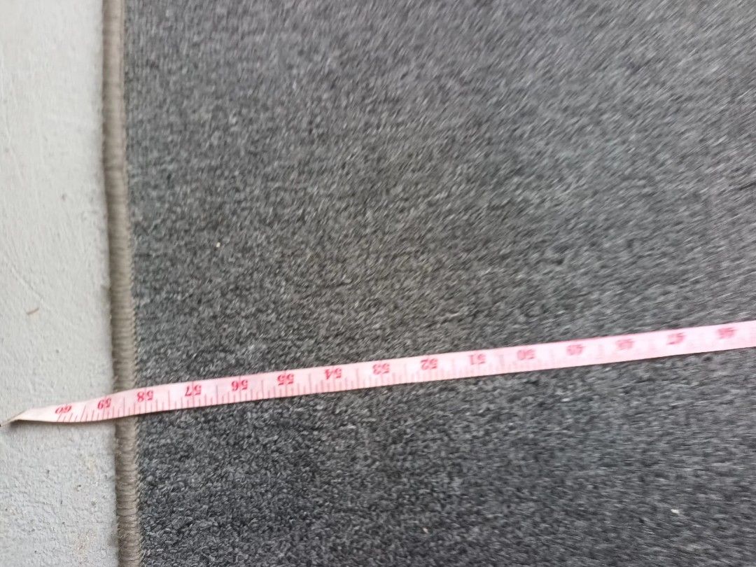 Grey Rectangular Carpet (Category: Carpets, Mats & Flooring) located in Paranaque City. Submitted by rizatamayo (Listing ID 1459995257, Image 3). Description: - Grey rectangular rug - Approximate dimensions: 60 inches x 30 inches - Ideal for entryways or hallways - Simple and functional design - Versatile fit for most spaces.